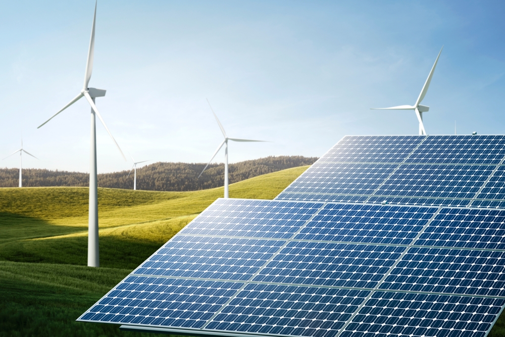 Fonti rinnovabili Pannelli solari e turbine eoliche in un campo verde